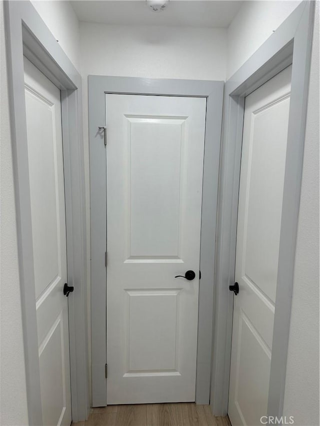 corridor featuring light hardwood / wood-style floors