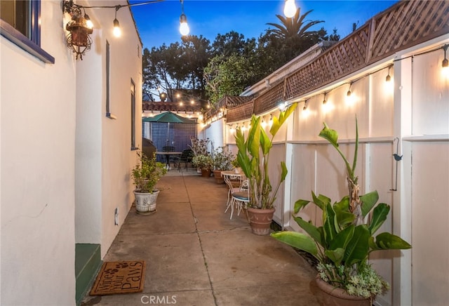 view of patio terrace at dusk