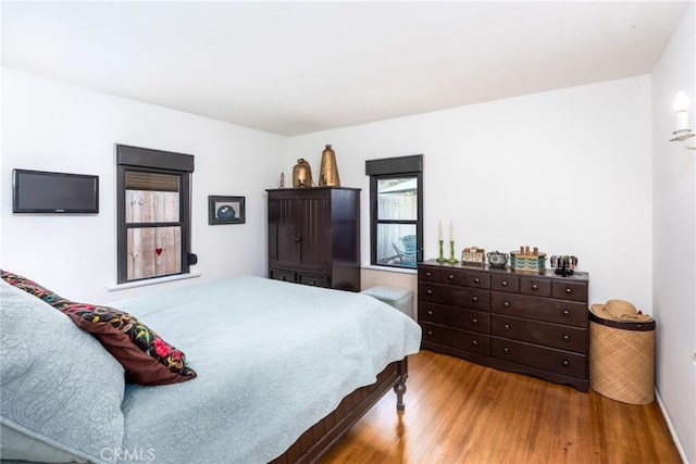 bedroom with light hardwood / wood-style floors