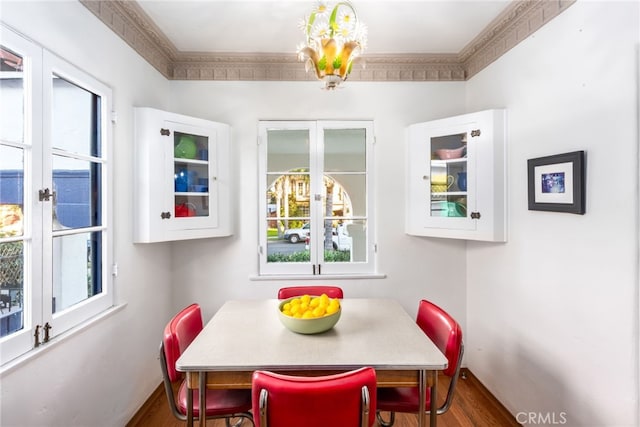 dining area featuring dark wood-type flooring and french doors