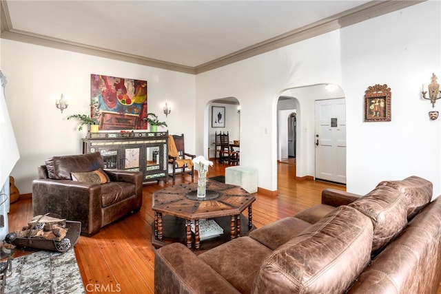 living room featuring hardwood / wood-style flooring and crown molding