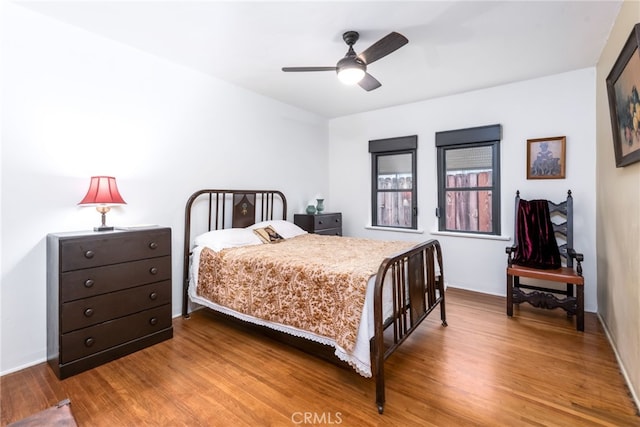 bedroom featuring ceiling fan and wood-type flooring