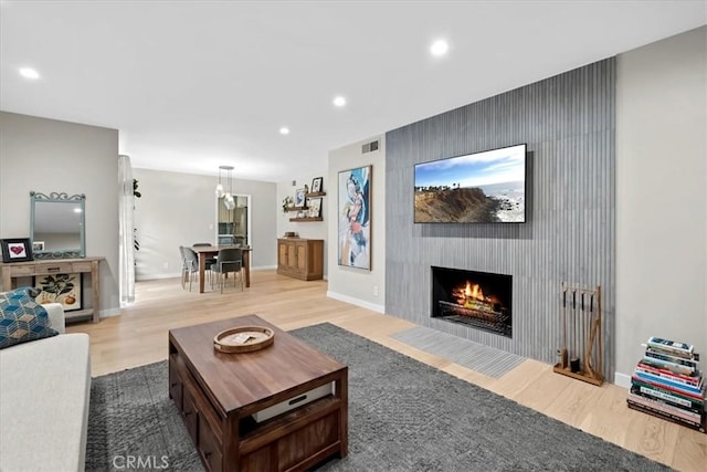 living room featuring hardwood / wood-style floors and a fireplace