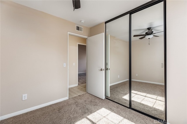 573 La Costa Dr, Banning, CA 92220 - unfurnished bedroom with carpet floors, a ceiling fan, visible vents, and a closet