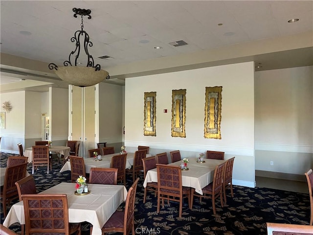 573 La Costa Dr, Banning, CA 92220 - dining space featuring carpet floors, visible vents, and baseboards