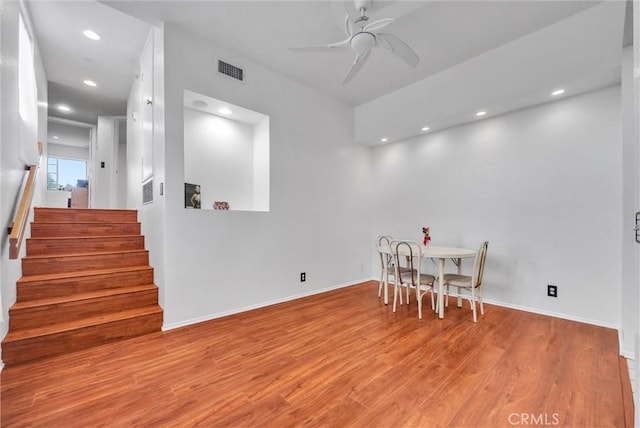 dining area featuring recessed lighting, stairs, visible vents, a ceiling fan, and wood finished floors