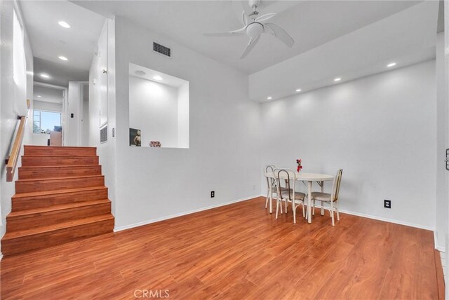 4900 N Grand Ave Unit 325, Covina, CA 91724 - dining area with wood finished floors, stairway, a ceiling fan, recessed lighting, and baseboards