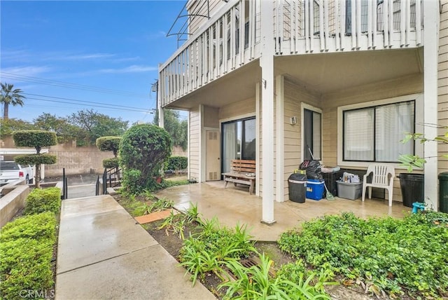view of patio featuring a balcony
