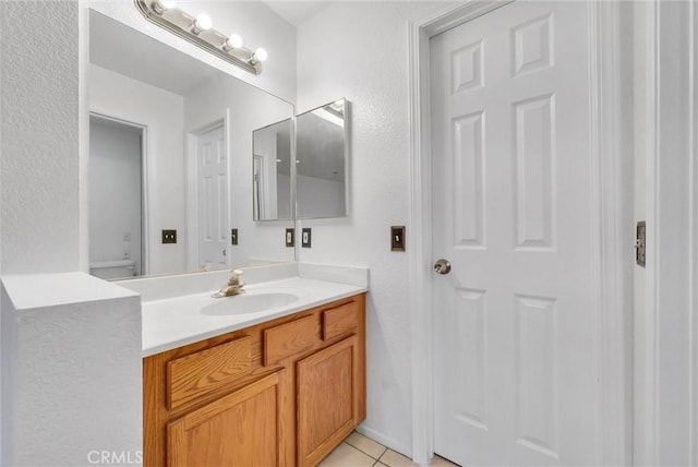 bathroom featuring tile patterned floors and vanity