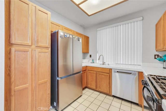 4900 N Grand Ave Unit 325, Covina, CA 91724 - kitchen with appliances with stainless steel finishes, a sink, light countertops, and light tile patterned floors