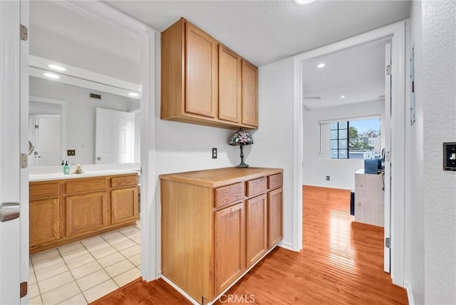 4900 N Grand Ave Unit 325, Covina, CA 91724 - hallway with light wood finished floors, recessed lighting, and baseboards