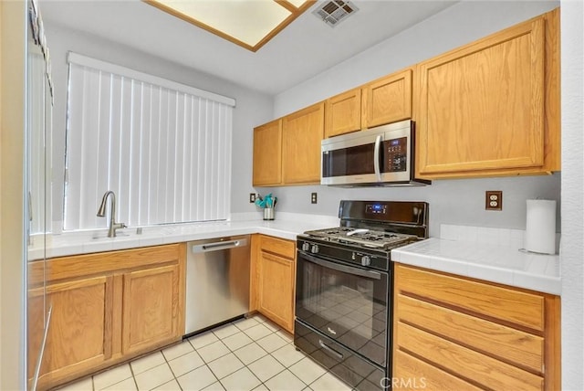 4900 N Grand Ave Unit 325, Covina, CA 91724 - kitchen featuring stainless steel appliances, a sink, and light tile patterned floors