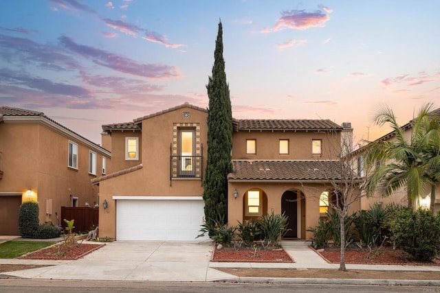 mediterranean / spanish-style home featuring a garage