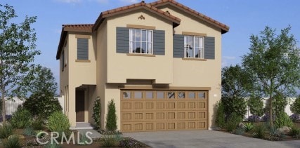 mediterranean / spanish house featuring a garage