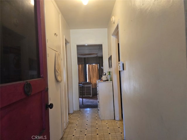 hallway featuring light floors