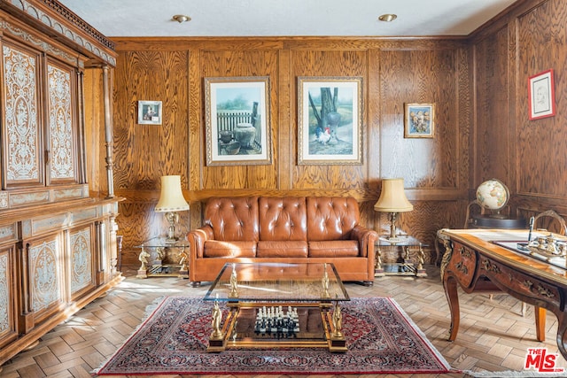 living area with wooden walls and light parquet floors