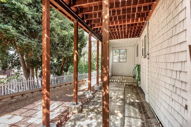 view of patio / terrace featuring fence