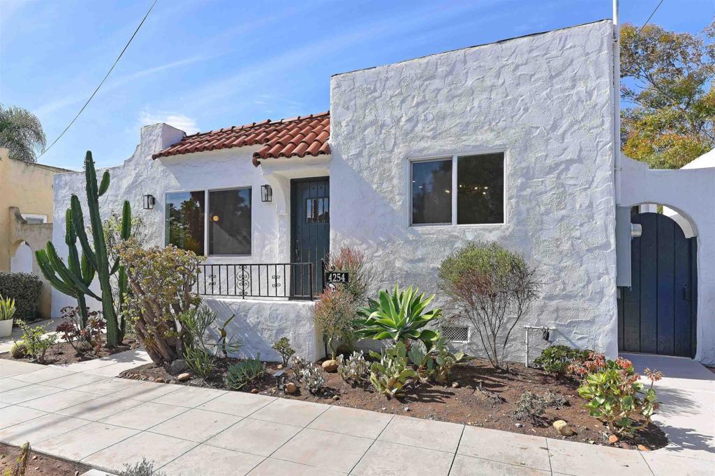 mediterranean / spanish-style home featuring stucco siding and a tiled roof