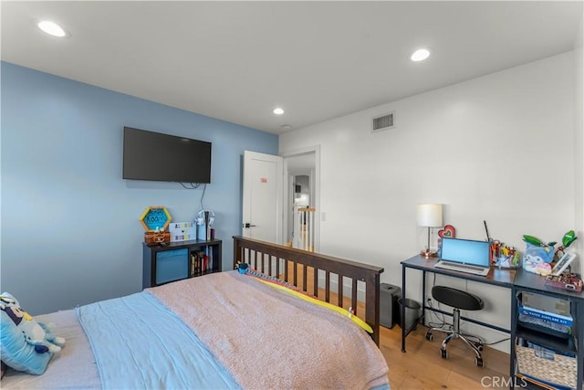 bedroom featuring light hardwood / wood-style floors