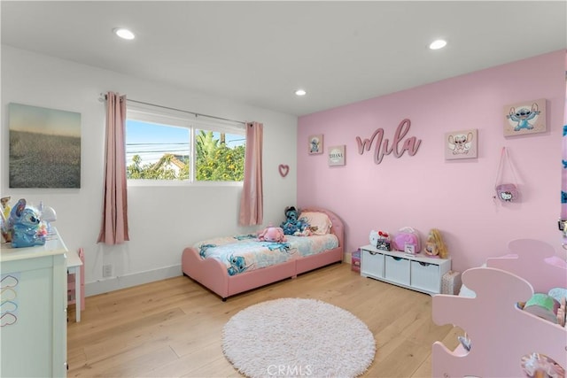 bedroom featuring light wood-type flooring