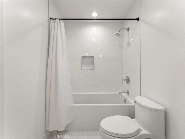 bathroom with shower / bathtub combination with curtain and toilet