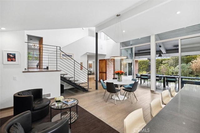 1900 Catalina St, Laguna Beach, CA 92651 - living room featuring recessed lighting, stairs, high vaulted ceiling, and wood finished floors