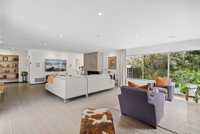 1900 Catalina St, Laguna Beach, CA 92651 - living room featuring a large fireplace, visible vents, recessed lighting, and hardwood / wood-style flooring