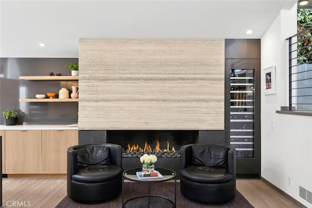 1900 Catalina St, Laguna Beach, CA 92651 - living area with a high end fireplace, light wood-style floors, visible vents, and wine cooler