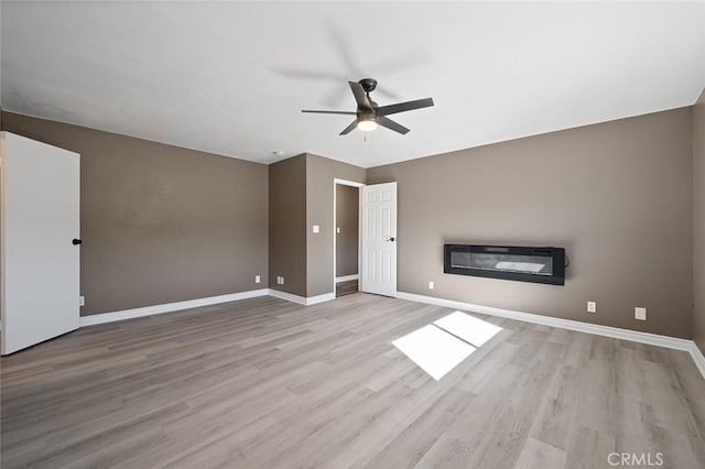 interior space featuring ceiling fan and light wood-type flooring