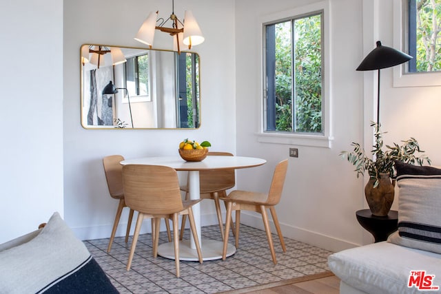 dining space with light wood-type flooring