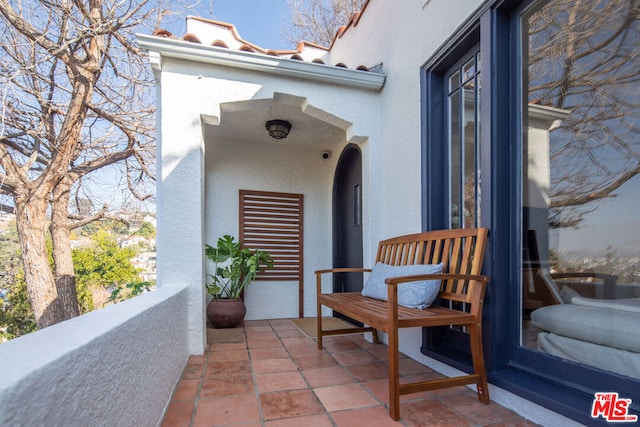 entrance to property with a balcony