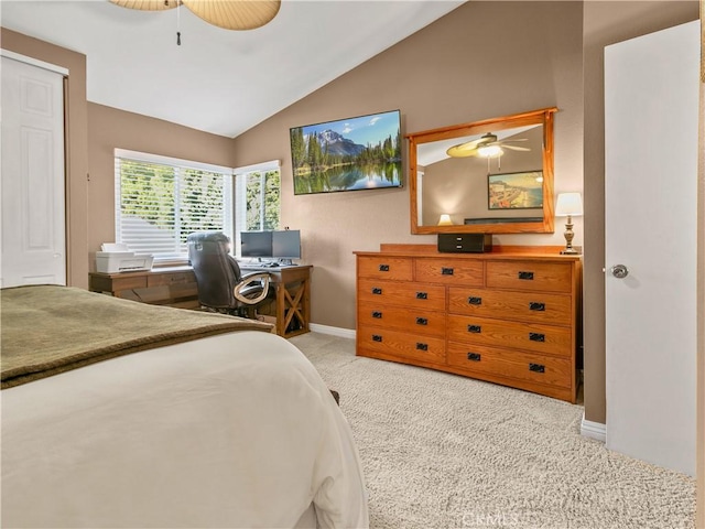 bedroom featuring baseboards, lofted ceiling, carpet, and ceiling fan