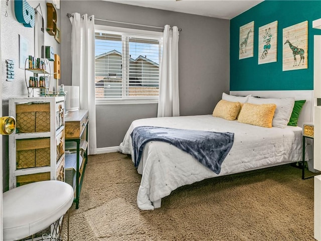 carpeted bedroom with baseboards