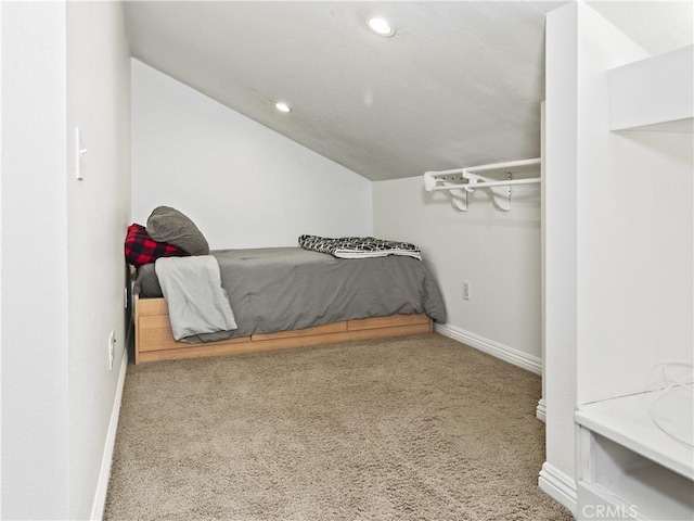 carpeted bedroom featuring recessed lighting, baseboards, and lofted ceiling