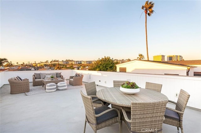 patio terrace at dusk with an outdoor hangout area