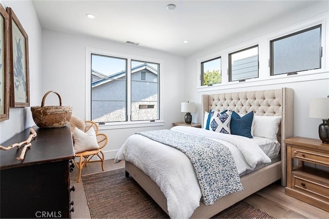 bedroom with hardwood / wood-style floors