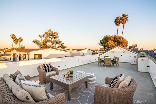 409 39th St, Newport Beach, CA 92663 - patio terrace at dusk featuring an outdoor living space, a patio area, and outdoor dining area