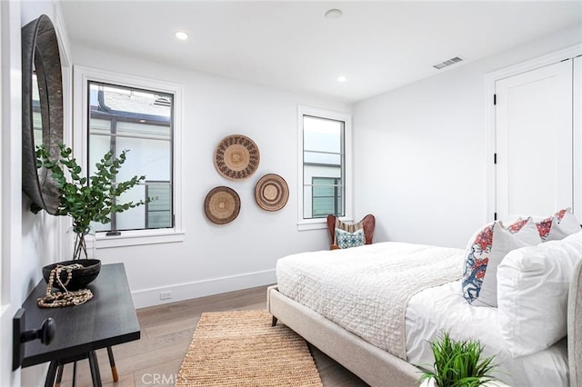 bedroom with light wood-type flooring