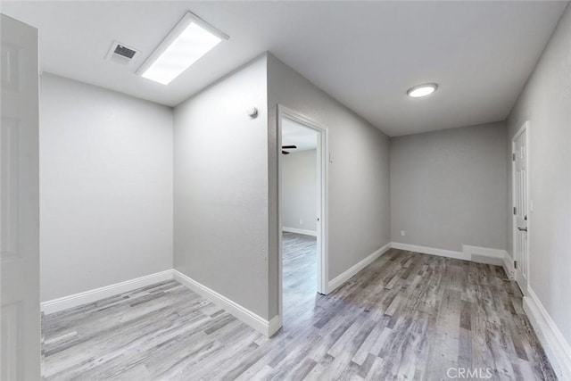 empty room with light hardwood / wood-style floors