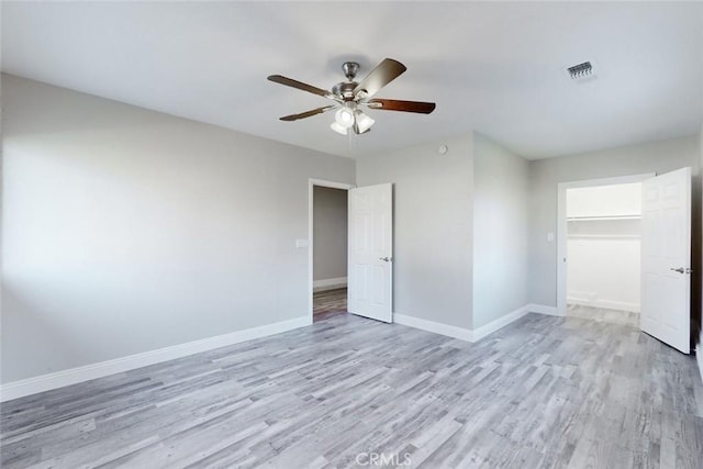 unfurnished room with light hardwood / wood-style flooring and ceiling fan