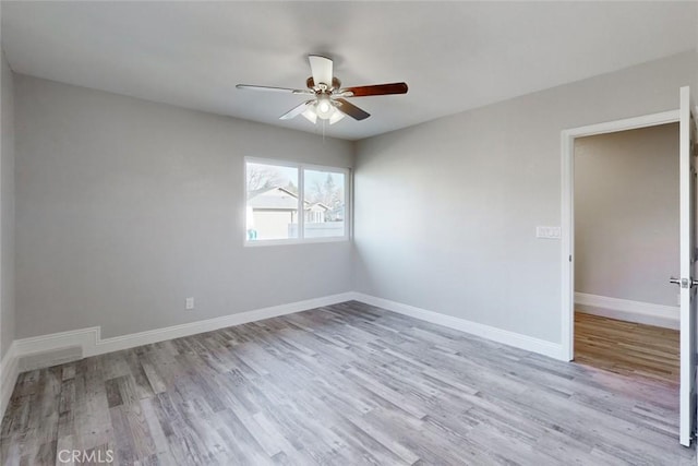 spare room with ceiling fan and light hardwood / wood-style floors