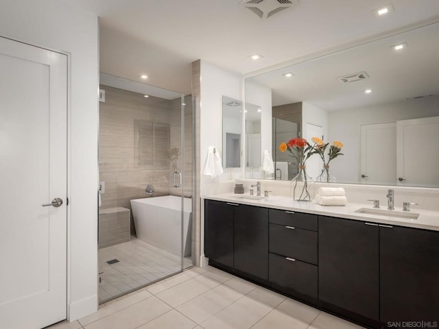 bathroom featuring vanity, tile patterned floors, and independent shower and bath