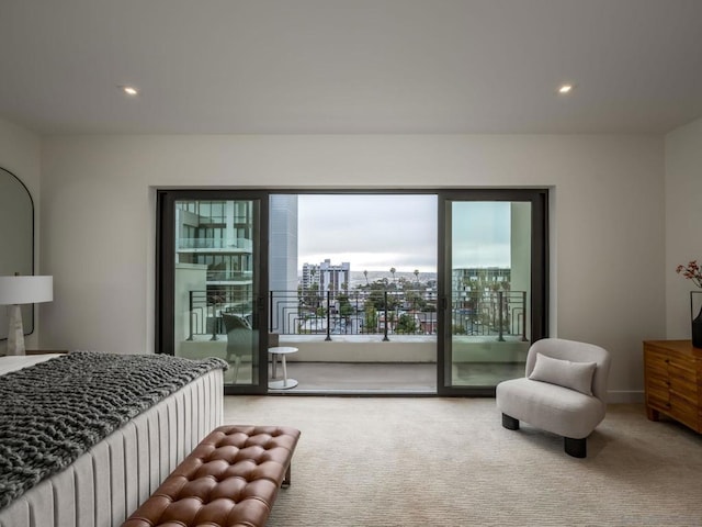 carpeted bedroom featuring access to outside