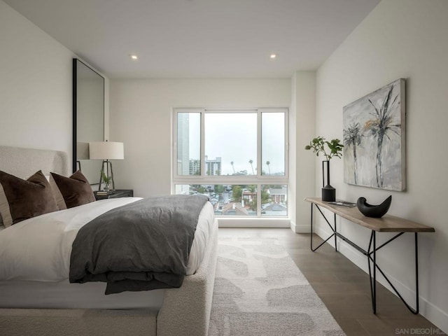 bedroom with hardwood / wood-style floors