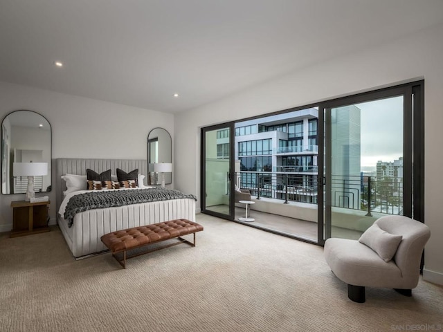 bedroom featuring light colored carpet and access to exterior