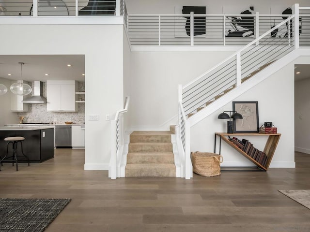 stairway featuring hardwood / wood-style floors