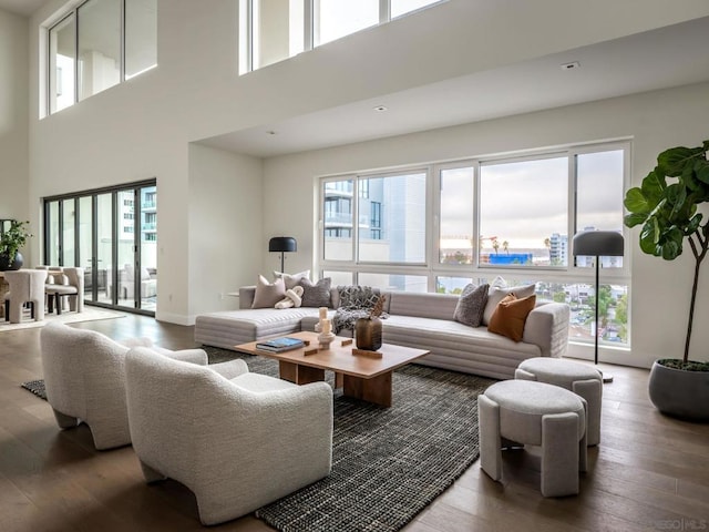 living room with a wealth of natural light and wood-type flooring