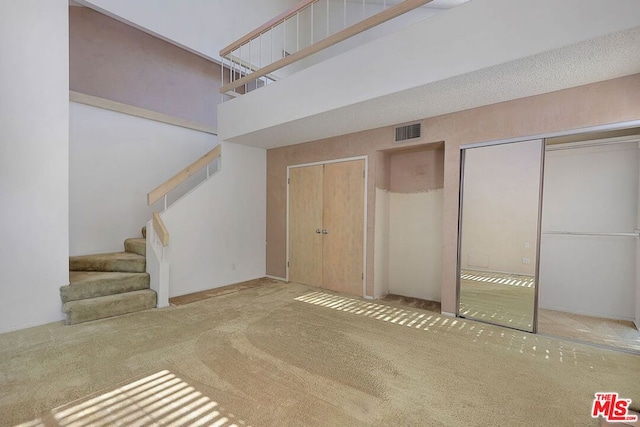 basement with light colored carpet