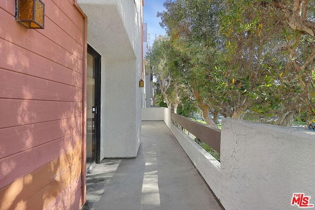 view of side of property featuring a balcony