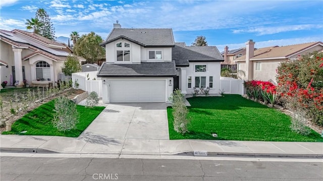 traditional-style home featuring a tile roof, concrete driveway, fence, a garage, and a front lawn